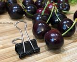 A picture of step 1 of #HowTo “Pit Cherries” with a binder clip? - Tuesday Tip.