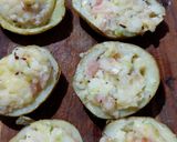 A picture of step 8 of "loaded" stuffed potato skins.