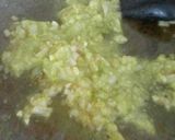 A picture of step 4 of Arroz Negro with Aioli.