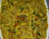 A picture of step 1 of Pasta with macaroni jollof.