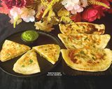 A picture of step 5 of Bolani - Afghani Breakfast - Flatbread Stuffed With Potatoes, Spring Onions, Cilantro And Spices.