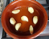 Foto del paso 10 de la receta: Cigalitas y ajos macerados en aceite de oliva confitados