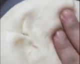 A picture of step 6 of Lussekatter- A Swedish Bun.