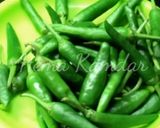 A picture of step 1 of Chilli Lemon Pickle (Raita Mirchi).
