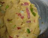 A picture of step 1 of Makke ki roti with green garlic leaves.
