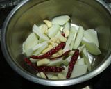 A picture of step 1 of Sweet and sour raw papaya pickle.