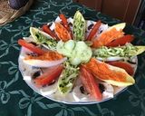 Une image de l'étape 2 de Salade « fleur » aux tomates endives courgettes concombre et champignons.