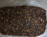A picture of step 6 of Til and peanuts date roll.