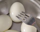A picture of step 1 of Achari Egg Biryani.