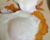 A picture of step 7 of Dimer jhal pitha (spicy fried poached egg).