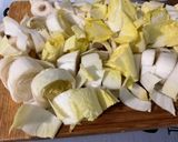A picture of step 7 of Endive Gratin with Red Bell Peppers, Ham, Honey, and Curry.