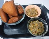 A picture of step 9 of Mahamri served with coconut mbaazi.