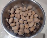 A picture of step 1 of Cajun Potatoes (baby potato cornflour).