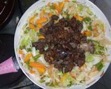 A picture of step 3 of White rice,palm oil stew and veg.sauce.