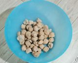 A picture of step 1 of Soya Chunks Capsicum & Onion Curry soyabeena badi ki sabji.