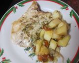Foto del paso 7 de la receta: Lubina al horno sobre cama de cebolla, papas y tomates cherry