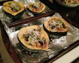 A picture of step 4 of Sweet & Fruity Blueberry-Plum Baked Acorn Squash.