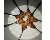 A picture of step 7 of Teriyaki chicken kebab in fork.