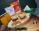 A picture of step 7 of Reshmi kabab burger with orange juice.