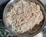 A picture of step 1 of Cheesy Noodles with Dumplings.