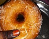 A picture of step 3 of Doughnut coated in sugar.