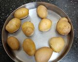 A picture of step 1 of Kashmiri Dum Aloo.