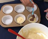 A picture of step 7 of NUTELLA SWIRL MUFFINS eggless.