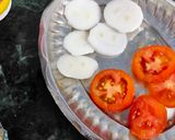 A picture of step 2 of Onion tomato sandwich no fire theme.