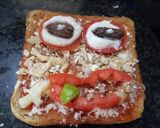 A picture of step 4 of Monster face pizza.