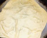 A picture of step 19 of Fateera with hotdog filling.