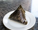 A picture of step 5 of Onigiri with bonito flakes and cheese.