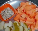 A picture of step 1 of Papaya Pear Coconut Smoothie with Roasted Sunflower Seeds.