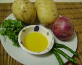 A picture of step 1 of Aloo Bhate (Mashed Potato).