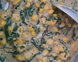 A picture of step 3 of Khari biscuit with white sauce topping.