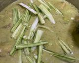 A picture of step 9 of Sohanjana and chicken in coconut green curry.