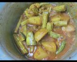 A picture of step 6 of Coconut drumstick curry.