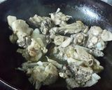 A picture of step 1 of Coconut chicken with fresh methi leaves.