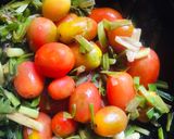 A picture of step 1 of Baby tomatoes spring onion soup.