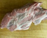 A picture of step 1 of Roasted garlic marinated pork collar with spicy Thai-style sauce.