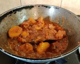 A picture of step 8 of Onion Tomato Chicken.