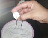 A picture of step 3 of Oreo vanilla ice cream with caramel sauce.