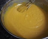 A picture of step 7 of Mango Blondie Bars with M&Ms.