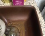 A picture of step 3 of Lotus biscoff strawberry Swiss roll cake.