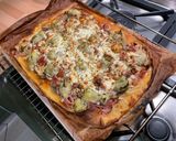 Une image de l'étape 13 de Pizza jambon tomate artichaut champignons emmental et mozzarella.