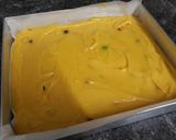 A picture of step 9 of Mango Blondie Bars with M&Ms.