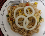 A picture of step 4 of Noodles with some veggies and egg.