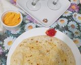 A picture of step 4 of Daal bhari roti with mango lassi.