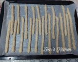 A picture of step 5 of Bosomat or Egyptian Breadsticks with Sesame Seeds.
