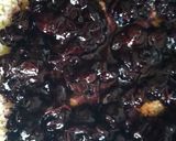 A picture of step 6 of Sponge cake filled with chunky blue berry jam.