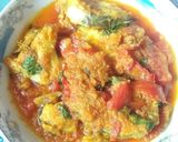 A picture of step 6 of Macher tortori(fish in tomato gravy).